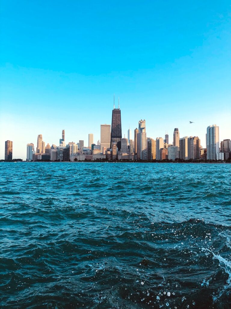 building beside sea under clear blue sky