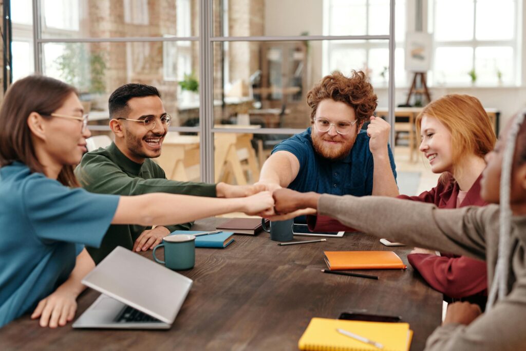 Coworkers Cooperating at Table