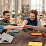 Coworkers Cooperating at Table